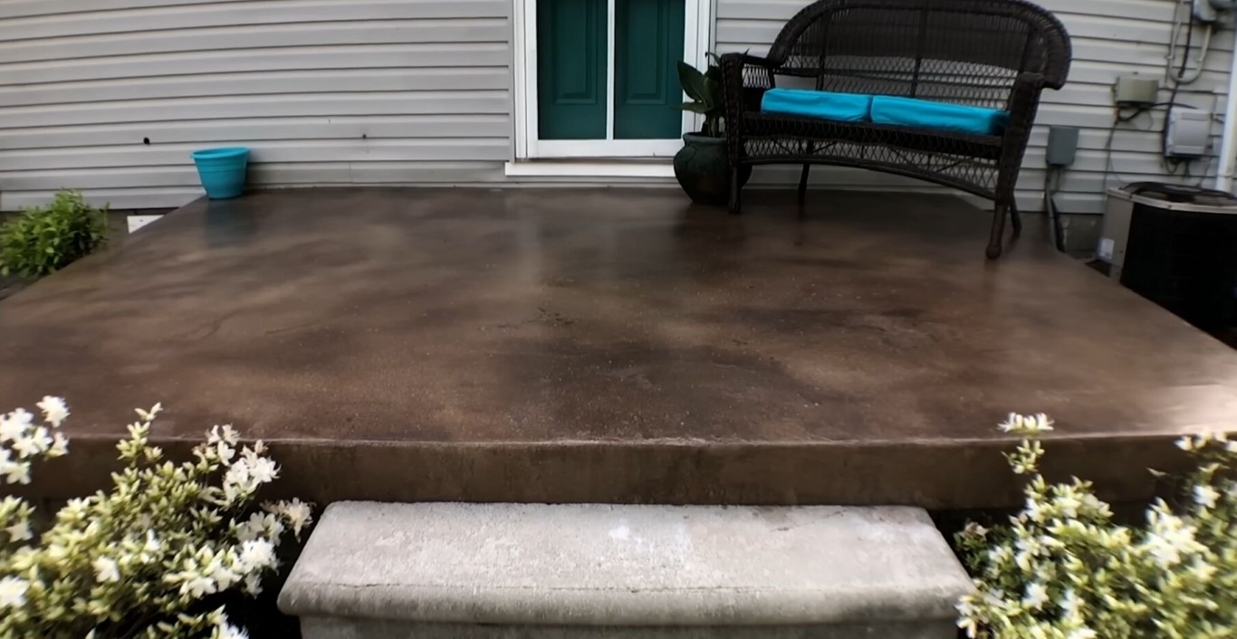 Custom concrete patio with outdoor furniture in Placentia, CA